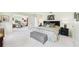This primary bedroom includes ensuite bathroom, and an adjacent space for an office or sitting area at 6948 W Country Club N Dr, Sarasota, FL 34243