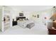 Spacious main bedroom with ensuite bath, adjacent dining room, and white carpet at 6948 W Country Club N Dr, Sarasota, FL 34243