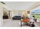 Bright home office with desk, sofa, chair, lots of natural light and adjacent bedroom view at 6948 W Country Club N Dr, Sarasota, FL 34243