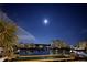 Beautiful night view of the buildings reflecting on the water under the moonlight sky at 4750 Cove Cir # 502, St Petersburg, FL 33708