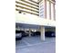 Covered parking area providing shaded spots for vehicles, located at the base of the condominium building at 4750 Cove Cir # 502, St Petersburg, FL 33708
