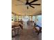 Spacious covered outdoor community picnic area with ceiling fans and several wooden picnic tables at 4750 Cove Cir # 502, St Petersburg, FL 33708