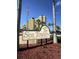 Sea Towers sign marking the entrance to this adult community, framed by palm trees and an American flag at 4750 Cove Cir # 502, St Petersburg, FL 33708