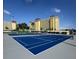 Well-maintained community tennis courts with condominium buildings in the background at 4750 Cove Cir # 502, St Petersburg, FL 33708