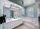 Bright bathroom with double vanity, soaking tub, and walk-in shower at 1052 Archway Dr, Spring Hill, FL 34608