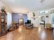 Spacious living room with hardwood floors and ample natural light at 1052 Archway Dr, Spring Hill, FL 34608