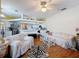 Bright, open-concept living space with hardwood flooring and a cozy atmosphere at 1052 Archway Dr, Spring Hill, FL 34608