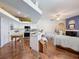 Open-concept living space with a kitchen island, modern appliances, and a seamless flow for easy living at 1052 Archway Dr, Spring Hill, FL 34608