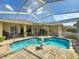 Beautiful screened pool area with brick pavers and well-maintained landscaping at 1052 Archway Dr, Spring Hill, FL 34608