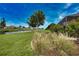 Serene canal-front property with mature trees and manicured lawn, offering a peaceful outdoor space at 536 Boundary Blvd, Rotonda West, FL 33947