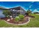 Backyard featuring a screened lanai, rock landscaping, and views of the canal at 536 Boundary Blvd, Rotonda West, FL 33947