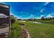 Expansive backyard with lush green lawn, waterfront views, and tropical landscaping at 536 Boundary Blvd, Rotonda West, FL 33947