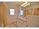 Bright bathroom with a single vanity, tile flooring, and a shower-tub combination at 536 Boundary Blvd, Rotonda West, FL 33947