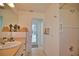 Bright bathroom with a single vanity, tile flooring, and a walk-in shower at 536 Boundary Blvd, Rotonda West, FL 33947