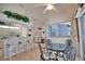 Bright breakfast nook offering views into the kitchen and the screened-in pool area at 536 Boundary Blvd, Rotonda West, FL 33947