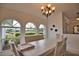 Bright dining area with ample natural light and a view of the well-maintained yard at 536 Boundary Blvd, Rotonda West, FL 33947