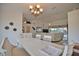 Inviting dining space overlooking the living room and backyard, illuminated by a stylish chandelier at 536 Boundary Blvd, Rotonda West, FL 33947