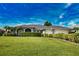 Beautiful single Gathering home featuring a well manicured lawn and attractive landscaping at 536 Boundary Blvd, Rotonda West, FL 33947