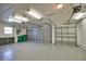 Spacious three-car garage with an epoxy floor, overhead lighting, and ample storage and includes garage door openers at 536 Boundary Blvd, Rotonda West, FL 33947
