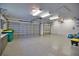 Spacious three car garage featuring epoxy floors, bright lighting and painted walls at 536 Boundary Blvd, Rotonda West, FL 33947