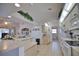Bright kitchen featuring tile floors, light countertops, and decorative greenery above the cabinets at 536 Boundary Blvd, Rotonda West, FL 33947