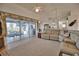 Cozy living room with comfortable sofa, tile floors, and views of the lanai at 536 Boundary Blvd, Rotonda West, FL 33947