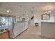 Bright living room with tile flooring, ceiling fan, and access to the lanai at 536 Boundary Blvd, Rotonda West, FL 33947