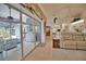Bright open-concept living area with sliding glass doors to outdoor patio, blending indoor/outdoor living at 536 Boundary Blvd, Rotonda West, FL 33947