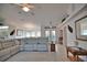 Comfortable living room with neutral tones, ceiling fan, tile floors, and charming decor at 536 Boundary Blvd, Rotonda West, FL 33947
