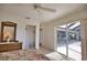 Bedroom featuring sliding glass doors to outdoor patio area and walk-in closet at 536 Boundary Blvd, Rotonda West, FL 33947