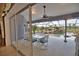 Enclosed patio with dining set overlooking pool and water feature, perfect for outdoor entertaining at 536 Boundary Blvd, Rotonda West, FL 33947