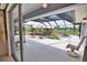 Inviting screened-in pool area featuring a rock waterfall, spa, and ample lounging space, creating a backyard oasis at 536 Boundary Blvd, Rotonda West, FL 33947