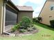 A well-maintained yard with lush greenery and landscaping surrounding the property at 13639 Salinas St, Venice, FL 34293