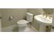 Half bathroom featuring a modern toilet, sink, and elegant fixtures at 13639 Salinas St, Venice, FL 34293