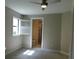 A charming bedroom with a ceiling fan and a window that filters in natural light at 13639 Salinas St, Venice, FL 34293