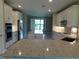 Contemporary kitchen with granite counters, stainless appliances, and a breakfast bar at 13639 Salinas St, Venice, FL 34293