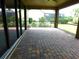 View from the lanai showing the brick flooring and expansive view of the outside at 13639 Salinas St, Venice, FL 34293