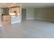 Spacious living room showcases a modern kitchen with white cabinets and a breakfast bar at 13639 Salinas St, Venice, FL 34293