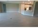 Open concept living space with island bar and adjacent kitchen at 13639 Salinas St, Venice, FL 34293