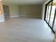 Bright living room features tile flooring and large sliding glass doors leading to the backyard at 13639 Salinas St, Venice, FL 34293