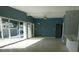 Spacious living room with an open layout, plenty of natural light, and modern ceiling fan at 21970 Cellini Ave, Port Charlotte, FL 33952