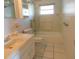 Tiled bathroom with a shower and tub at 3536 Harbor Blvd, Port Charlotte, FL 33952
