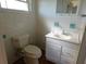 Tiled bathroom featuring a sink and vanity with storage at 3536 Harbor Blvd, Port Charlotte, FL 33952