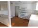 Bright kitchen featuring white cabinets, modern appliances, and wood flooring at 3536 Harbor Blvd, Port Charlotte, FL 33952