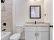 Bathroom featuring modern fixtures, a tiled shower, and neutral color palette at 14 S Forest St, Plant City, FL 33563