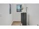 Utility room featuring a new water heater and a window providing natural light at 14 S Forest St, Plant City, FL 33563