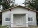 Newly constructed home with clean lines and modern facade at 14 S Forest St, Plant City, FL 33563