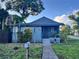 Charming bungalow with a gray exterior, landscaping, and walkway at 1500 5Th W St, Palmetto, FL 34221