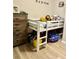 A bedroom with a lofted bed, a dresser, and playful decor at 3433 Dragon View Ct, Valrico, FL 33594