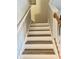 Staircase with wood-look treads and white risers at 3433 Dragon View Ct, Valrico, FL 33594